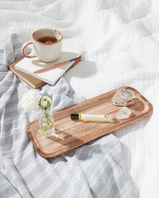 Cozy winter essentials including Apoterra's aromatherapy perfume oil