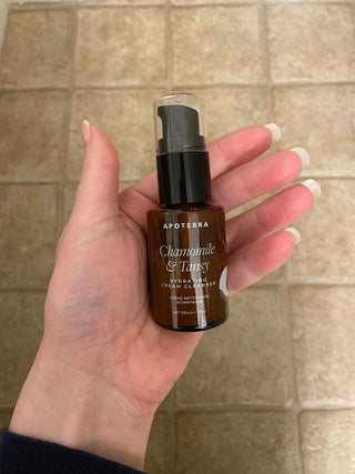 Apoterra Chamomile & Tansy hydrating cream cleanser in hand