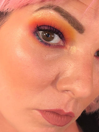 Close-up of eye with vibrant eyeshadow, makeup look