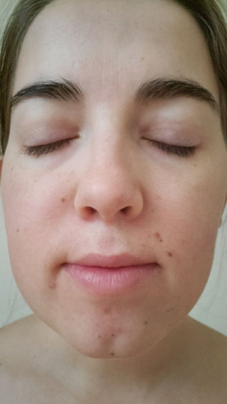 Woman with eyes closed, close-up