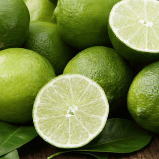 Fresh limes, some sliced open