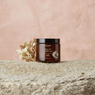 Rose Body Butter jar on stone