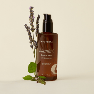 Tulsi and Lavender Vitamin C Body Oil by Apoterra main product image featuring the amber bottle and lavender flowers