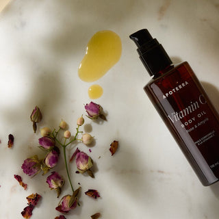 Vitamin C Body Oil Rose & Amyris essential oils texture oil lifestyle photos with dried rose petals